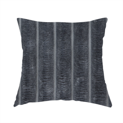 The fabric used to create this handmade cushion is a charcoal grey, vertically ribbed, channel-tufted plush fabric.