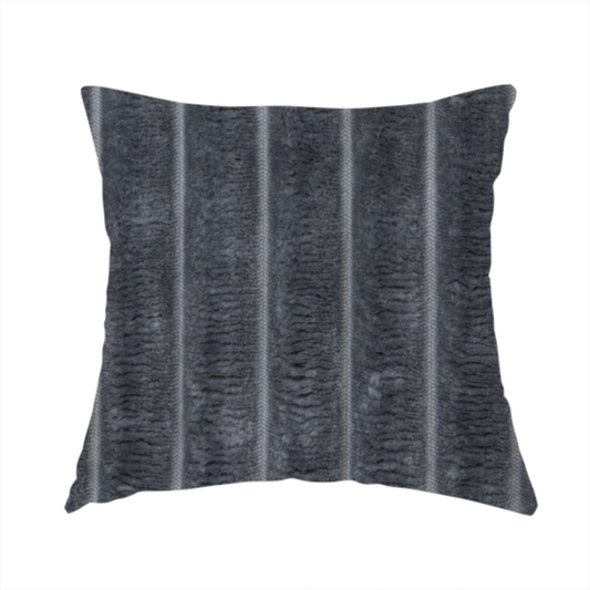 The fabric used to create this handmade cushion is a charcoal grey, vertically ribbed, channel-tufted plush fabric.