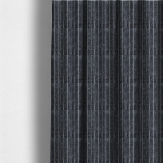 The fabric used to create these made-to-measure curtains is a charcoal grey, vertically ribbed, channel-tufted plush fabric.