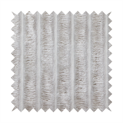 A silver vertically ribbed, channel-tufted plush fabric.