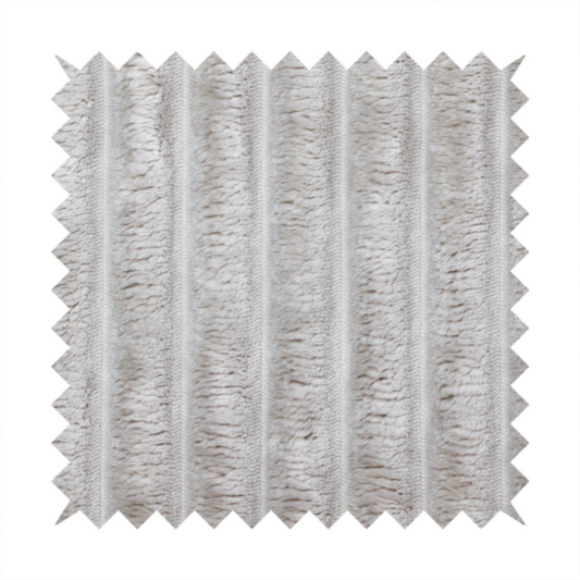 A silver vertically ribbed, channel-tufted plush fabric.