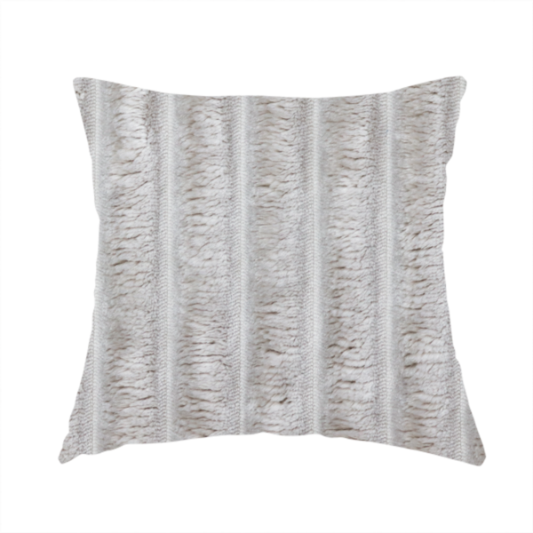 The fabric used to create this handmade cushion is a silver vertically ribbed, channel-tufted plush fabric.