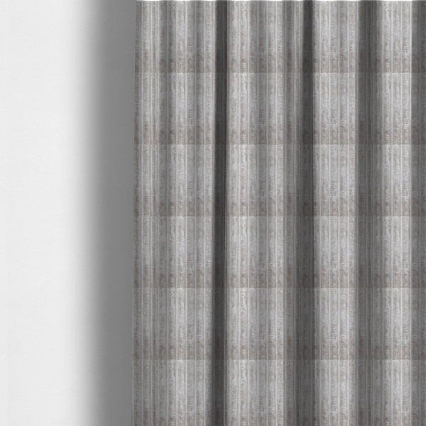 The fabric used to create this made-to-measure curtain is a silver vertically ribbed, channel-tufted plush fabric.