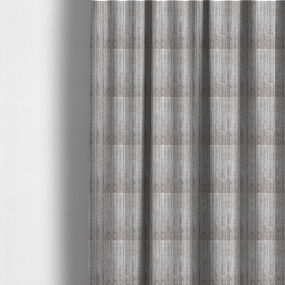 The fabric used to create this made-to-measure curtain is a silver vertically ribbed, channel-tufted plush fabric.