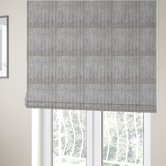 The fabric used to create these Roman blinds is a silver vertically ribbed, channel-tufted plush fabric.