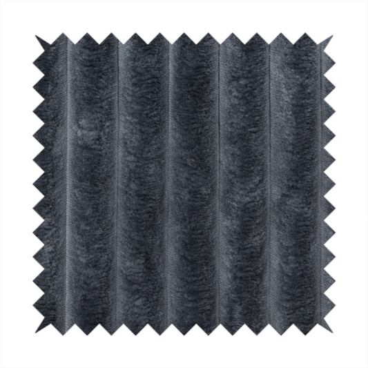 A charcoal grey, vertically ribbed, channel-tufted plush fabric.