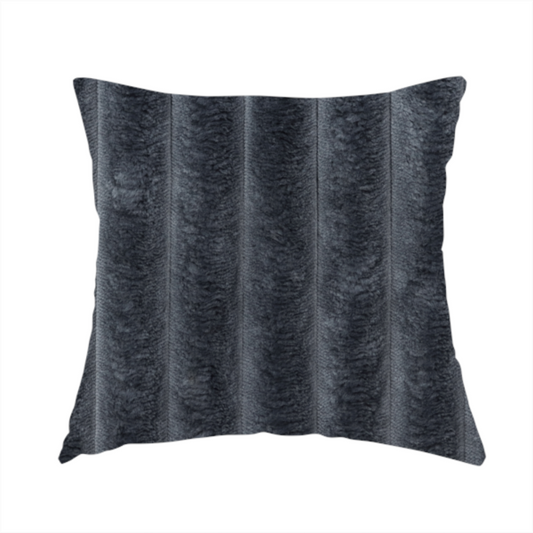 The fabric used to create this handmade cushion is a charcoal grey, vertically ribbed, channel-tufted plush fabric.