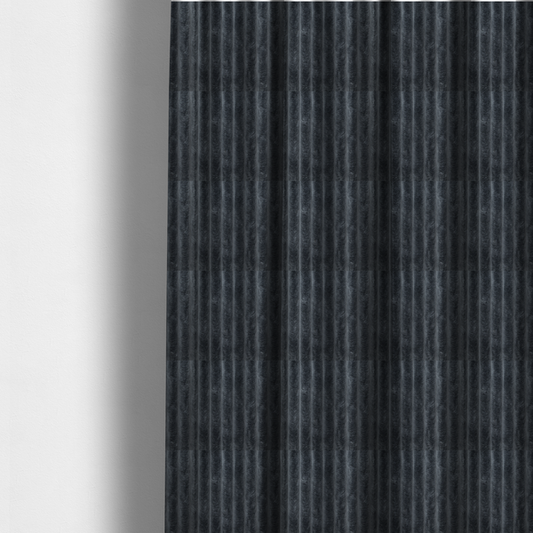 The fabric used to create these made-to-measure curtains is a charcoal grey, vertically ribbed, channel-tufted plush fabric.