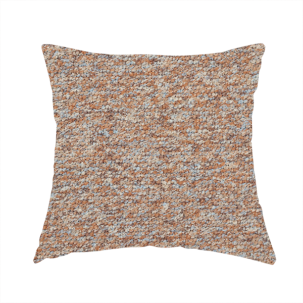 The fabric used to create this handmade cushion is a terracotta, and soft blue-grey textured upholstery fabric with a durable finish.