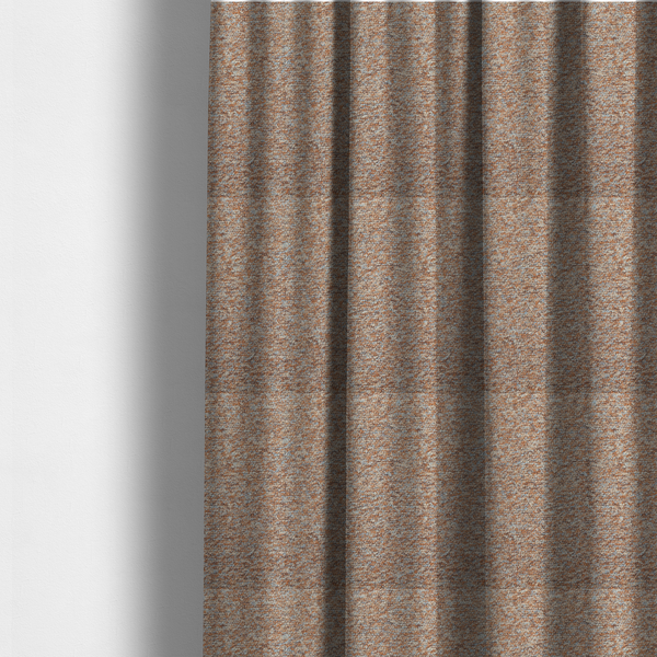 The fabric used to create these made-to-measure curtains is a terracotta, and soft blue-grey textured upholstery fabric with a durable finish.