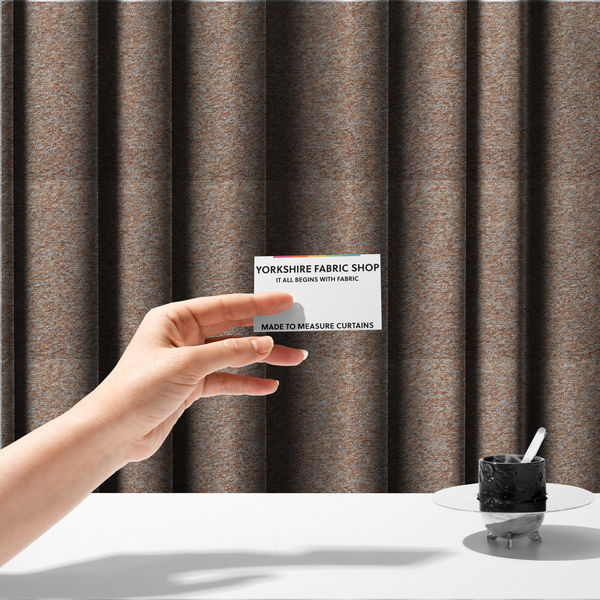 The fabric used to create these made-to-measure curtains is a terracotta, and soft blue-grey textured upholstery fabric with a durable finish.