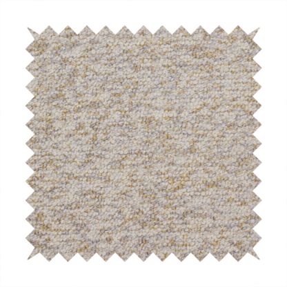 A cream, light grey, and subtle mustard yellow textured upholstery fabric.
