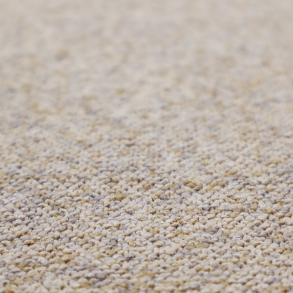 A cream, light grey, and subtle mustard yellow textured upholstery fabric.
