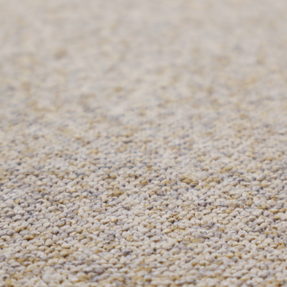 A cream, light grey, and subtle mustard yellow textured upholstery fabric.