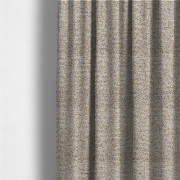 The fabric used to create these made-to-measure curtains is a cream, light grey, and subtle mustard yellow textured upholstery fabric.