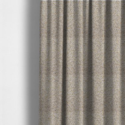 The fabric used to create these made-to-measure curtains is a cream, light grey, and subtle mustard yellow textured upholstery fabric.