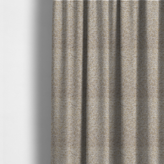 The fabric used to create these made-to-measure curtains is a cream, light grey, and subtle mustard yellow textured upholstery fabric.