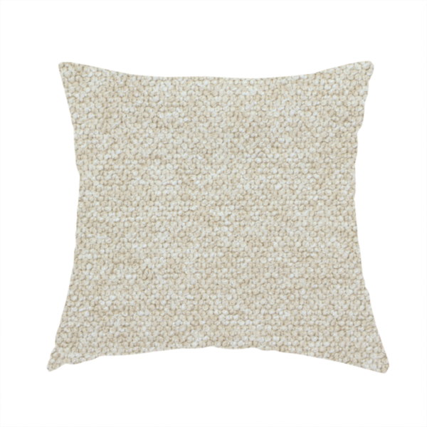 The fabric used to create this handmade cushion is a creamy off-white textured upholstery fabric with a consistent, neutral weave.