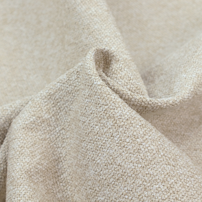 A creamy off-white textured upholstery fabric with a consistent, neutral weave.