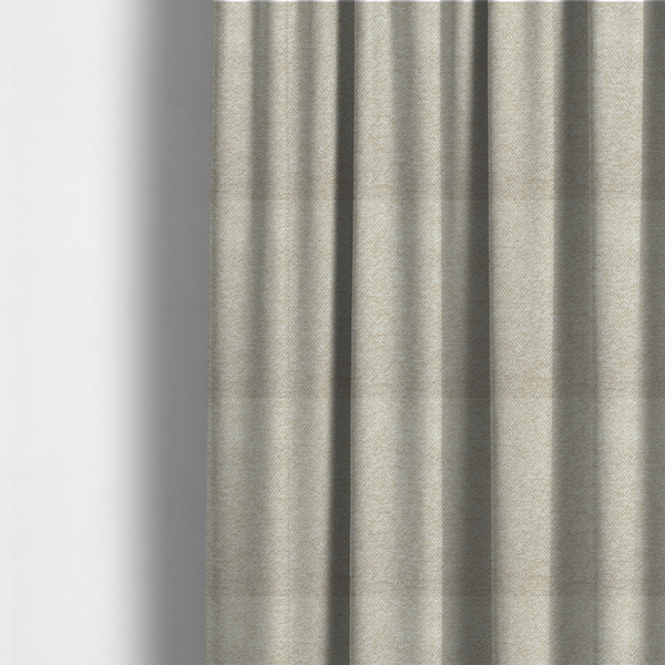 The fabric used to create these made-to-measure curtains is a creamy off-white textured upholstery fabric with a consistent, neutral weave.