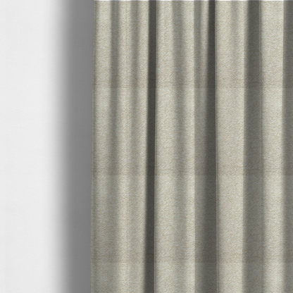 The fabric used to create these made-to-measure curtains is a creamy off-white textured upholstery fabric with a consistent, neutral weave.