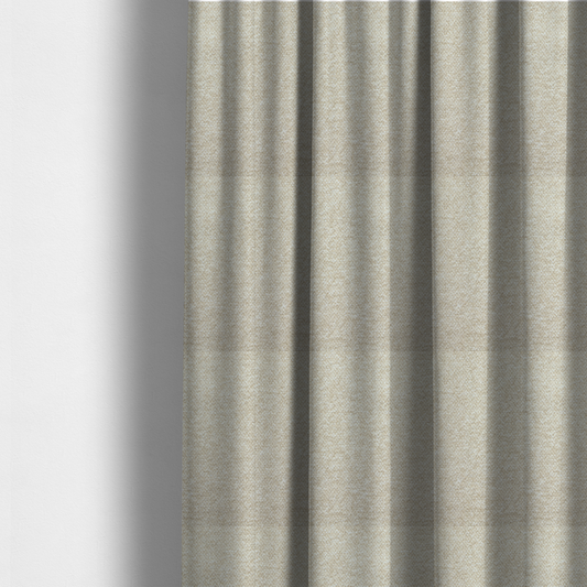 The fabric used to create these made-to-measure curtains is a creamy off-white textured upholstery fabric with a consistent, neutral weave.