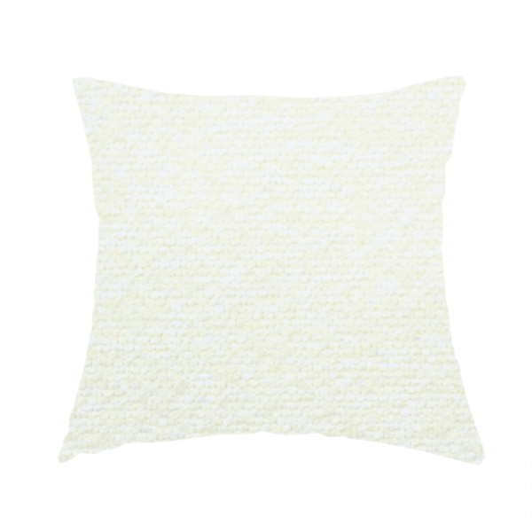 The fabric used to create this handmade cushion is a bright off-white textured upholstery fabric with a clean, light weave.