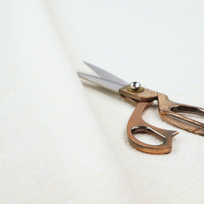 A bright off-white textured upholstery fabric with a clean, light weave.