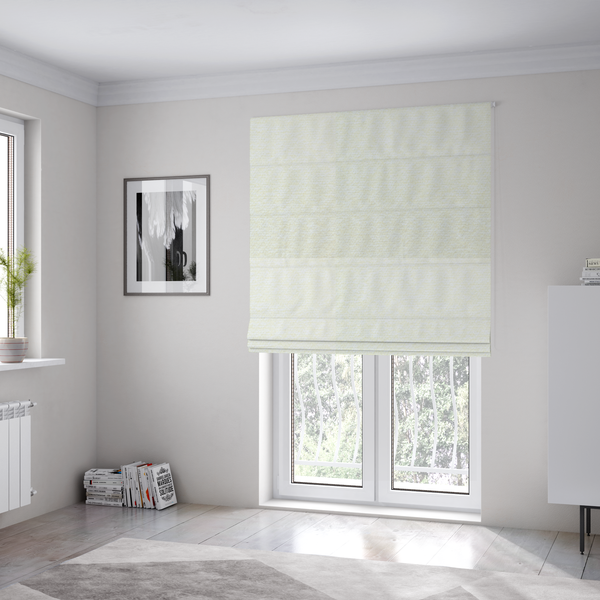 The fabric used to create these Roman blinds is a bright off-white textured upholstery fabric with a clean, light weave.