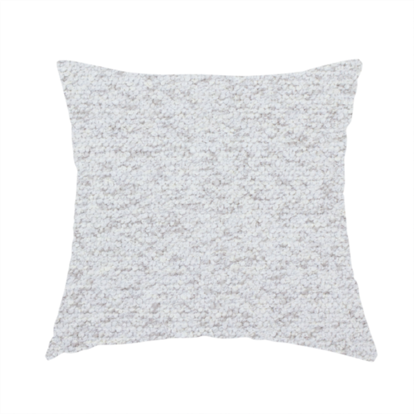The fabric used to create this handmade cushion is a light cool-toned grey and white blend textured upholstery fabric.