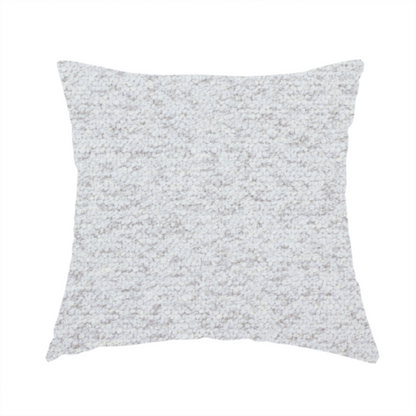 The fabric used to create this handmade cushion is a light cool-toned grey and white blend textured upholstery fabric.