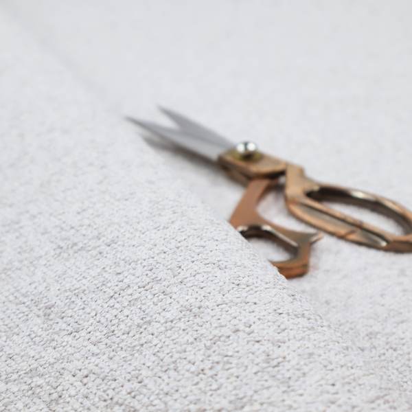 A light cool-toned grey and white blend textured upholstery fabric.