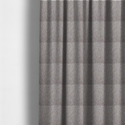The fabric used to create these made-to-measure curtains is a muted blue-grey and earthy terracotta mixed textured upholstery fabric.