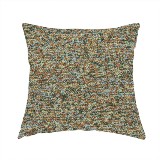The fabric used to create this handmade cushion is a earthy blend of forest green, terracotta, and grey textured upholstery fabric.