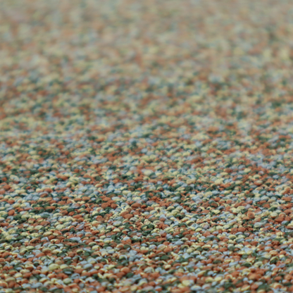 An earthy blend of forest green, terracotta, and grey textured upholstery fabric.