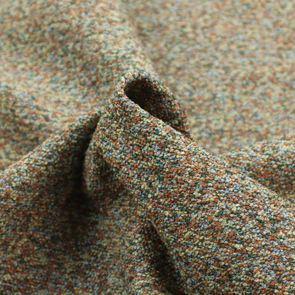 An earthy blend of forest green, terracotta, and grey textured upholstery fabric.