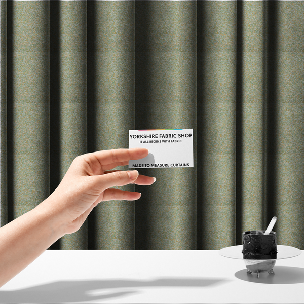 The fabric used to create these made-to-measure curtains is a pale sage green, soft yellow, and white textured upholstery fabric.