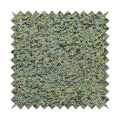 A high-contrast lime green, dark green, and yellow textured upholstery fabric.