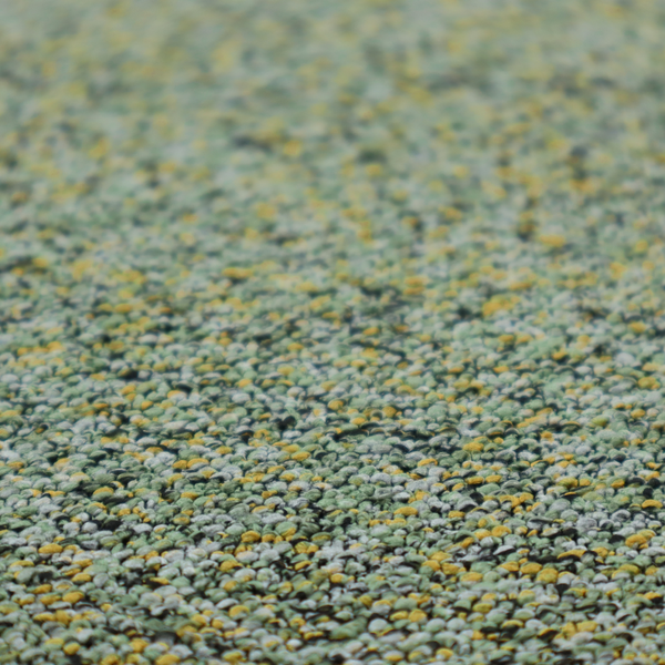 A high-contrast lime green, dark green, and yellow textured upholstery fabric.