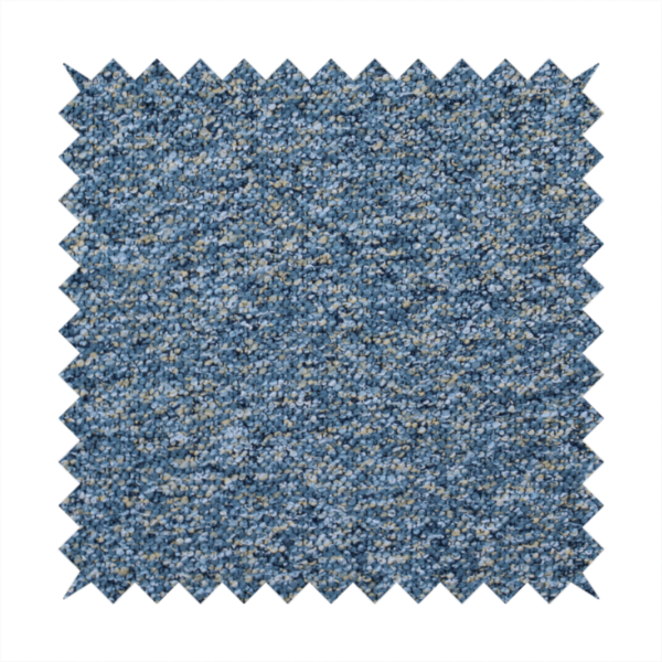 A  mid-tone blue textured upholstery fabric with subtle cream and yellow flecks.