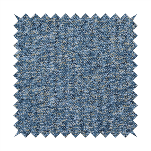 A  mid-tone blue textured upholstery fabric with subtle cream and yellow flecks.