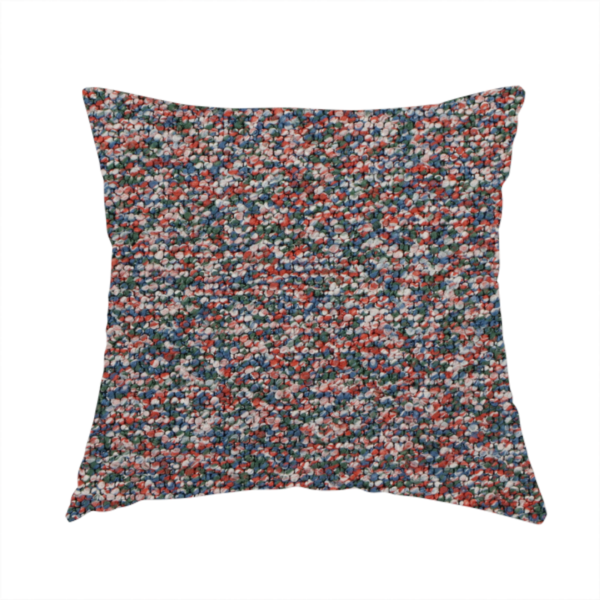 The fabric used to create this handmade cushion is a multi-coloured textured upholstery fabric, featuring a blend of red, blue, green, and white fibres.