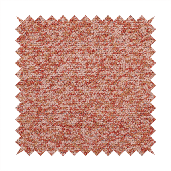 A soft coral and cream upholstery fabric featuring a detailed, textured, and nubby weave.