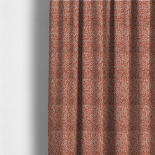The fabric used to create these made-to-measure curtains is a soft coral and cream upholstery fabric featuring a detailed, textured, and nubby weave.