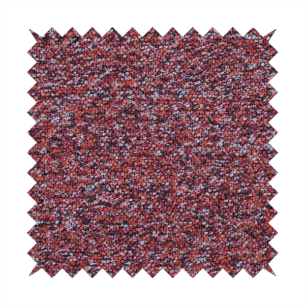 A warm, rustic red and deep terracotta upholstery fabric, showcasing a complex, nubby texture and rich colour variation.