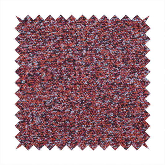 A warm, rustic red and deep terracotta upholstery fabric, showcasing a complex, nubby texture and rich colour variation.