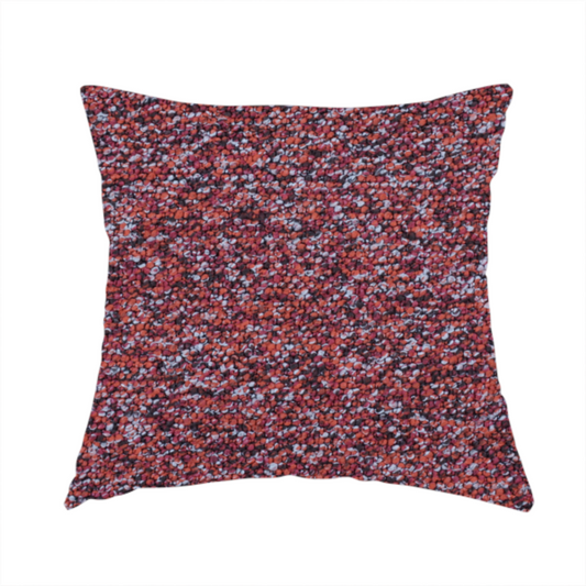 The fabric used to create this handmade cushion is a warm, rustic red and deep terracotta upholstery fabric, showcasing a complex, nubby texture and rich colour variation.