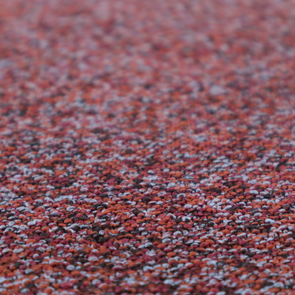 A warm, rustic red and deep terracotta upholstery fabric, showcasing a complex, nubby texture and rich colour variation.