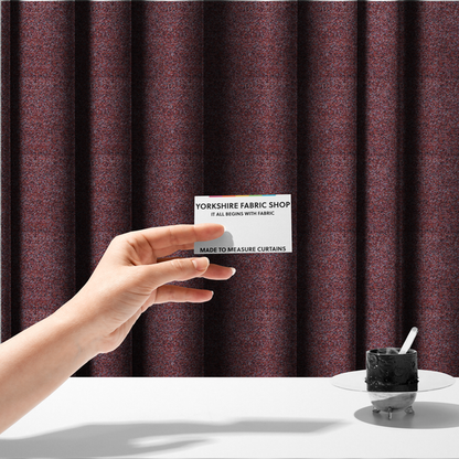 The fabric used to create this handmade cushion is a warm, rustic red and deep terracotta upholstery fabric, showcasing a complex, nubby texture and rich colour variation.