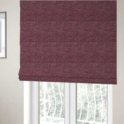 The fabric used to create these Roman blinds is a warm, rustic red and deep terracotta upholstery fabric, showcasing a complex, nubby texture and rich colour variation.